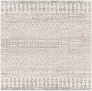 Close-up of the Chinnor Area Rug. Bohemian style rug with charcoal, light gray, and off-white geometric patterns. Design-Square-710