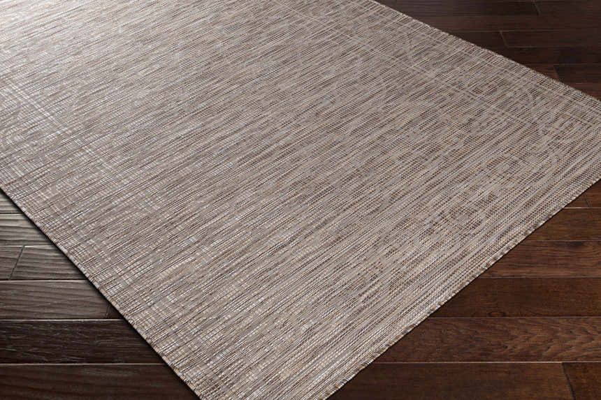 Close-up of the Coolville Brown Flatweave Area Carpet showing its woven texture and neutral brown, cream, and tan colors. Corner