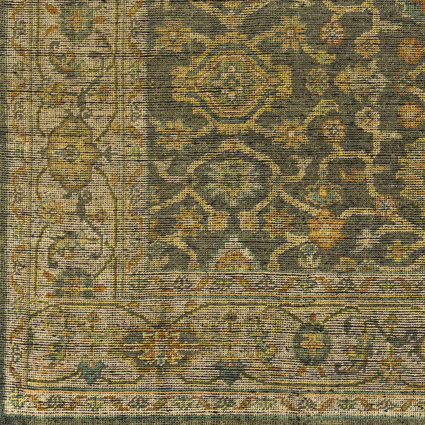 Close-up of the Clunes Area Rug. Hand-knotted wool rug in black, brown, grass green, light beige, sage, and yellow. Floral pattern. Swatch