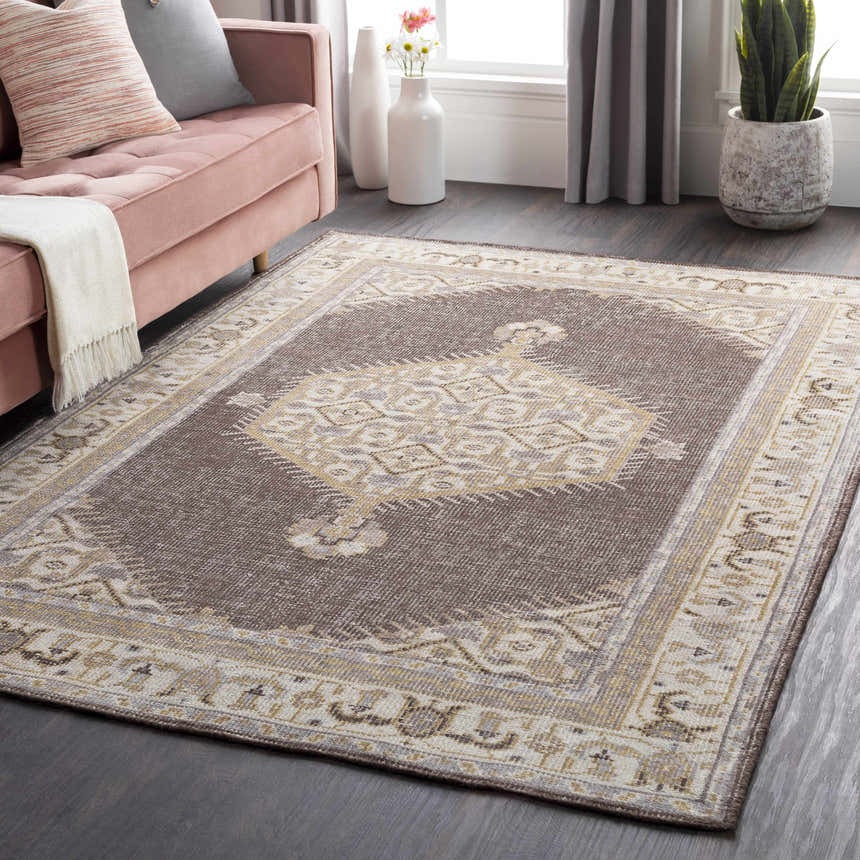 Brown Clyo Carpet, a hand-knotted wool rug with traditional design in a styled living room. Roomscene-Rectangle