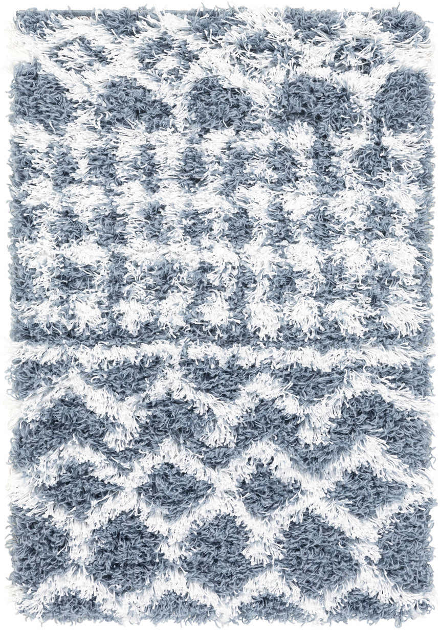 Close-up of the Camp Shag Area Rug, a denim and white shag rug with a geometric pattern. Soft, plush texture. Design-Rectangle-23