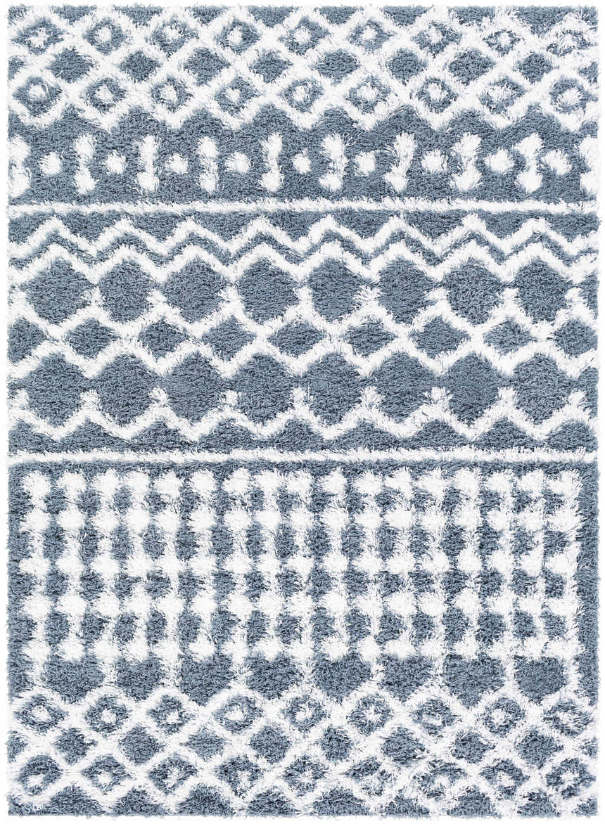 Close-up of the Camp Shag Area Rug. Denim and white geometric shag rug with a bohemian design. Design-Rectangle-5373