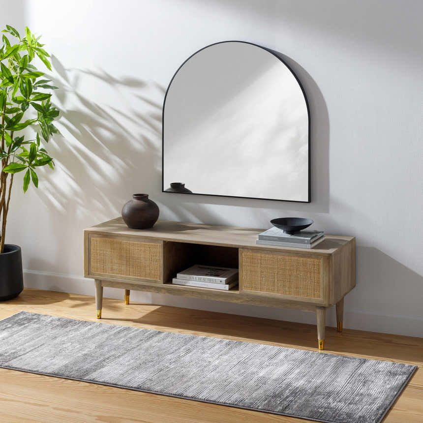 Living room scene with gray Coombs Area Rug, wood console table, and arched mirror. Roomscene-Runner