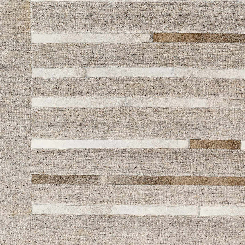 Close-up of the Cantu Premium Viscose&Leather Area Rug. Features a geometric design with beige, gray, and leather stripes. Swatch