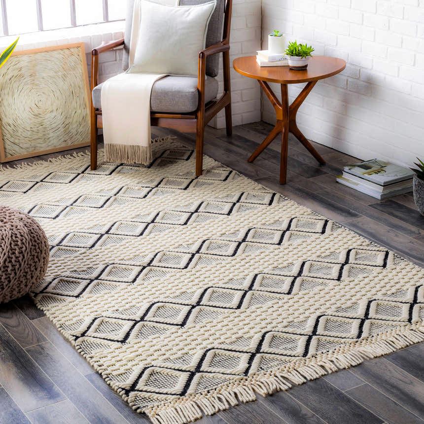 Farmhouse living room scene with a cream and black geometric Cobourg Area Carpet. Roomscene-Rectangle