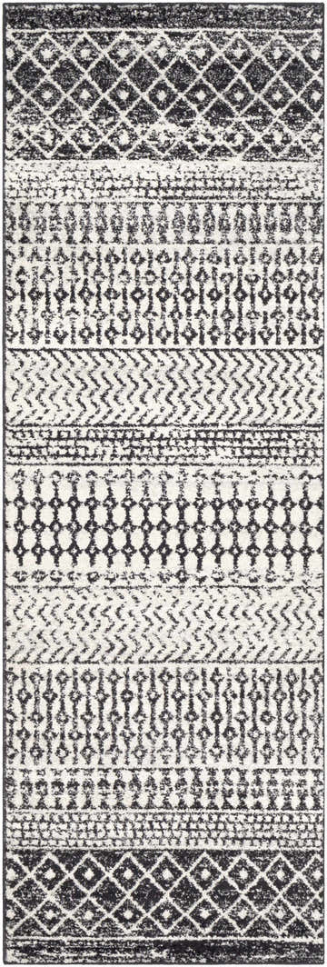 Close-up of the Constantin Area Rug. Black and white rug with a bohemian geometric pattern and soft texture. Design-Runner-2776