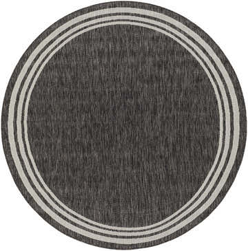 Close-up of a round Coonamble Bordered Antrasit Rug. Charcoal gray rug with a cream striped border. Design-Round-67