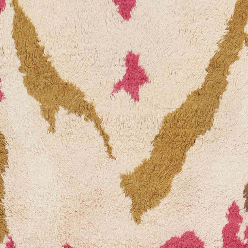 Close-up of the Crenshaw Carpet: a hand-woven shag rug with a light pink, mustard, and dark brown abstract design. Swatch