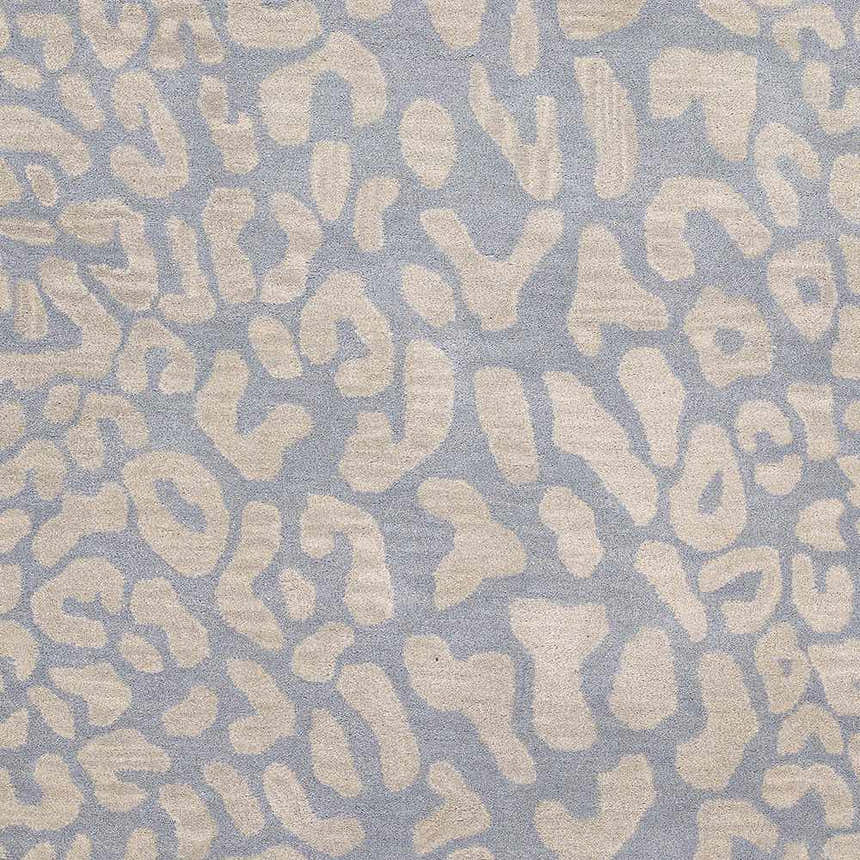 Close-up of the Curwensville Leopard Print Area Rug in slate and taupe wool, featuring a hand-tufted animal pattern. Swatch