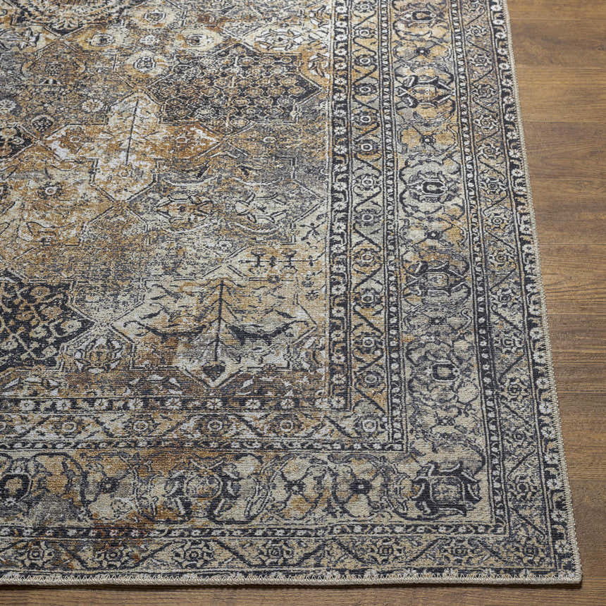 Close-up of the Dagatan Washable Area Rug, showcasing its beige, black, and camel traditional Oriental pattern. Front