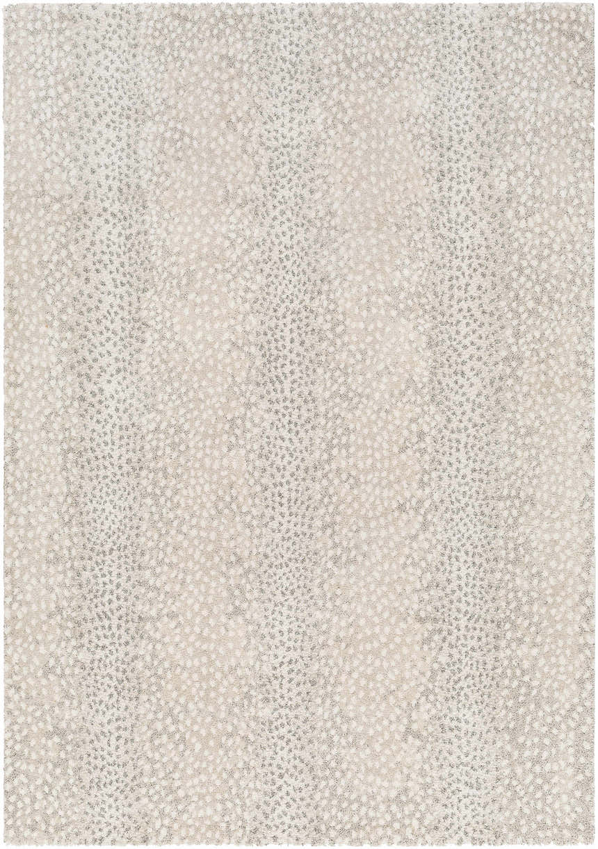 Close-up of the Daiva Luxe Rug, showcasing a beige and gray dotted pattern and soft, textured weave. Design-Rectangle-537