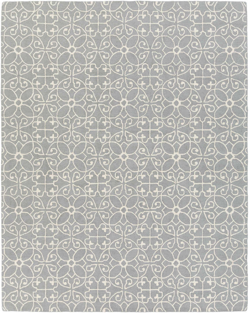 Close-up of the Davie Area Rug. Hand-tufted wool rug in slate blue with an ivory geometric floral pattern. Design-Rectangle-810