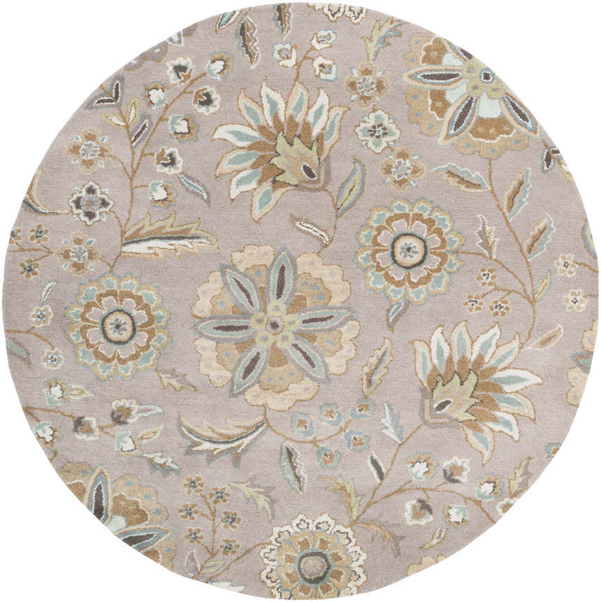 Close-up of the round Denio Area Rug. Floral pattern in brown, dusty sage, light blue and taupe on a light brown wool rug. Design-Round-6