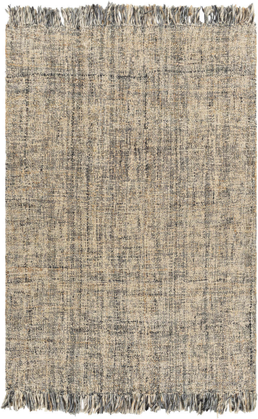 Close-up of the Edgely Area Rug. Hand woven jute and wool rug in black, gray, light beige, and tan with fringe. Design-Rectangle-576