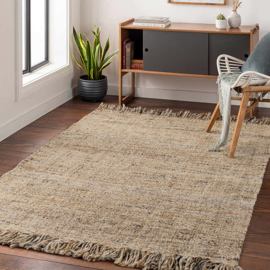 Living room scene with a tan Edgely Area Rug, wood floors, and mid-century modern cabinet. Roomscene-Rectangle