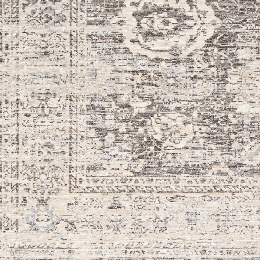 Close-up of the Divisoria Area Rug. Charcoal, cream, and gray traditional rug with a farmhouse style pattern. Swatch