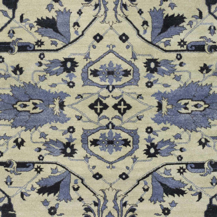 Close-up of Doraville Area Carpet featuring a traditional floral pattern in black, blue, and seafoam on a light background. Swatch