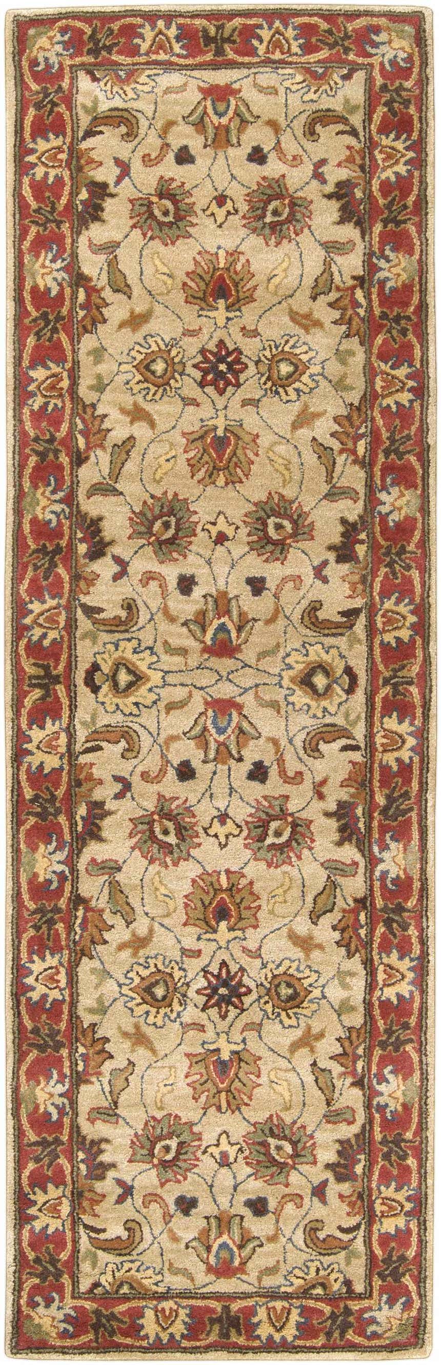 Detailed floral pattern of the Cherryfield Hand Tufted Brown & Rust Wool Rug. Features brick red, brown, and tan colors. Design-Runner-268