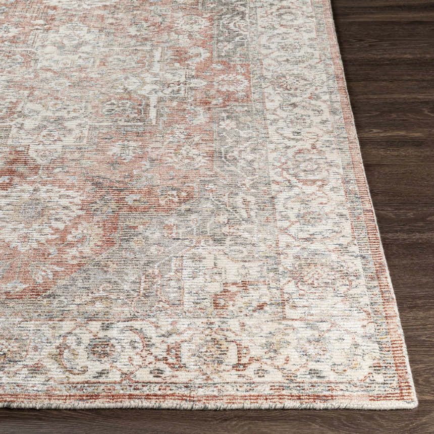 Close-up of the hand-knotted Dunmor Area Rug. Brick red, charcoal, cream, and gray oriental pattern on wool and viscose blend. Front