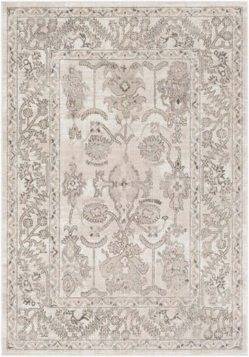 Close-up of the Eckelson Area Rug. Farmhouse style rug in black, light slate, tan, and white with a traditional floral pattern. Design-Rectangle-5376