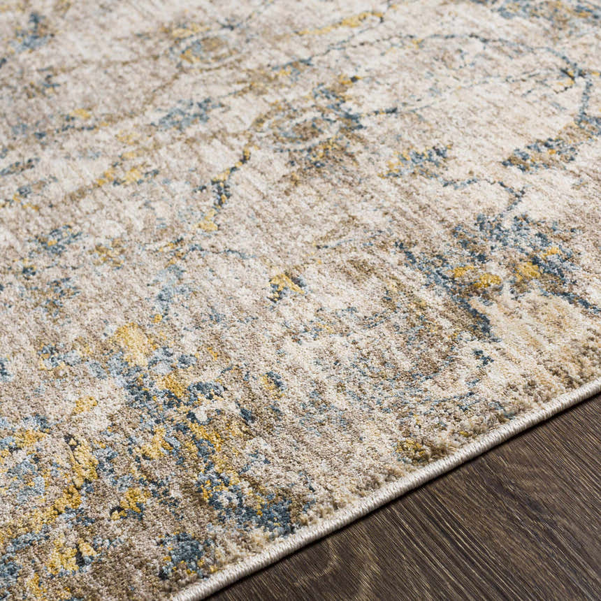 Close-up of the Morinville Teal Floral Rug showing its traditional pattern, teal, tan, and mustard colors, and machine-woven texture. Texture
