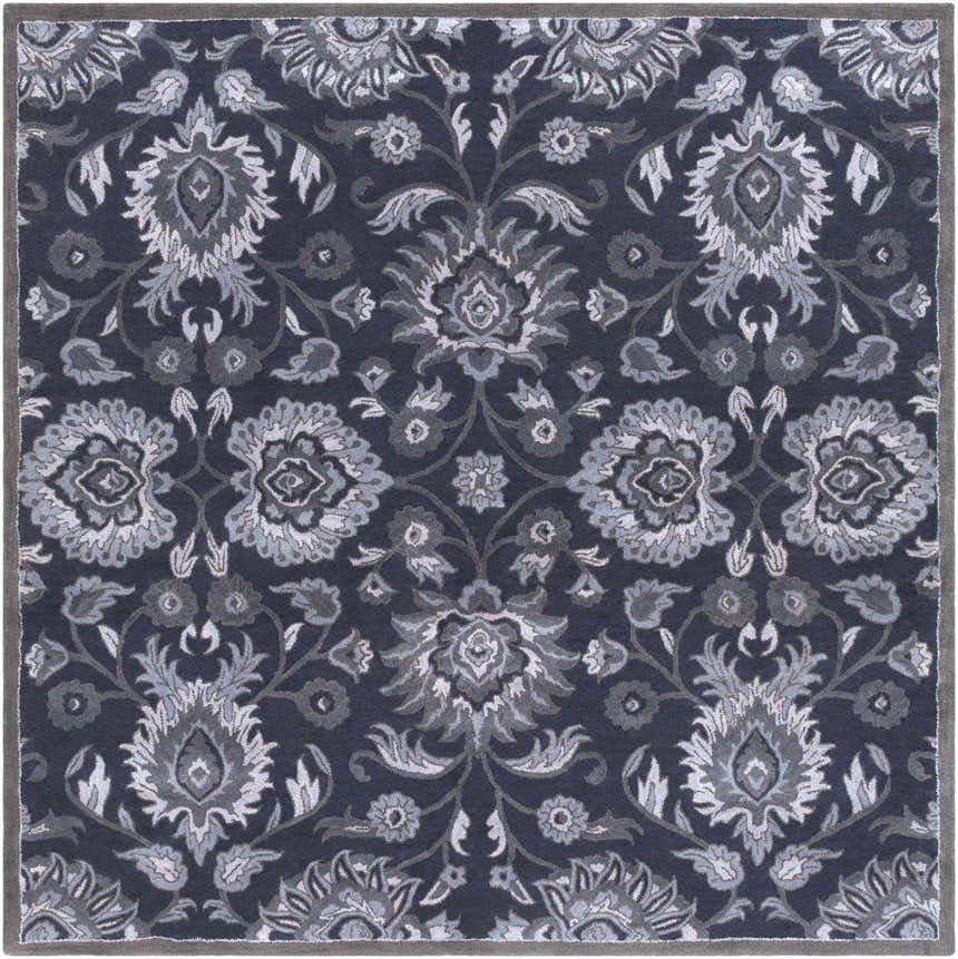 Detailed floral pattern of the Conesus Hand Tufted Blue Area Rug. Bohemian style wool rug in charcoal, denim, and slate blue. Design-Square-8
