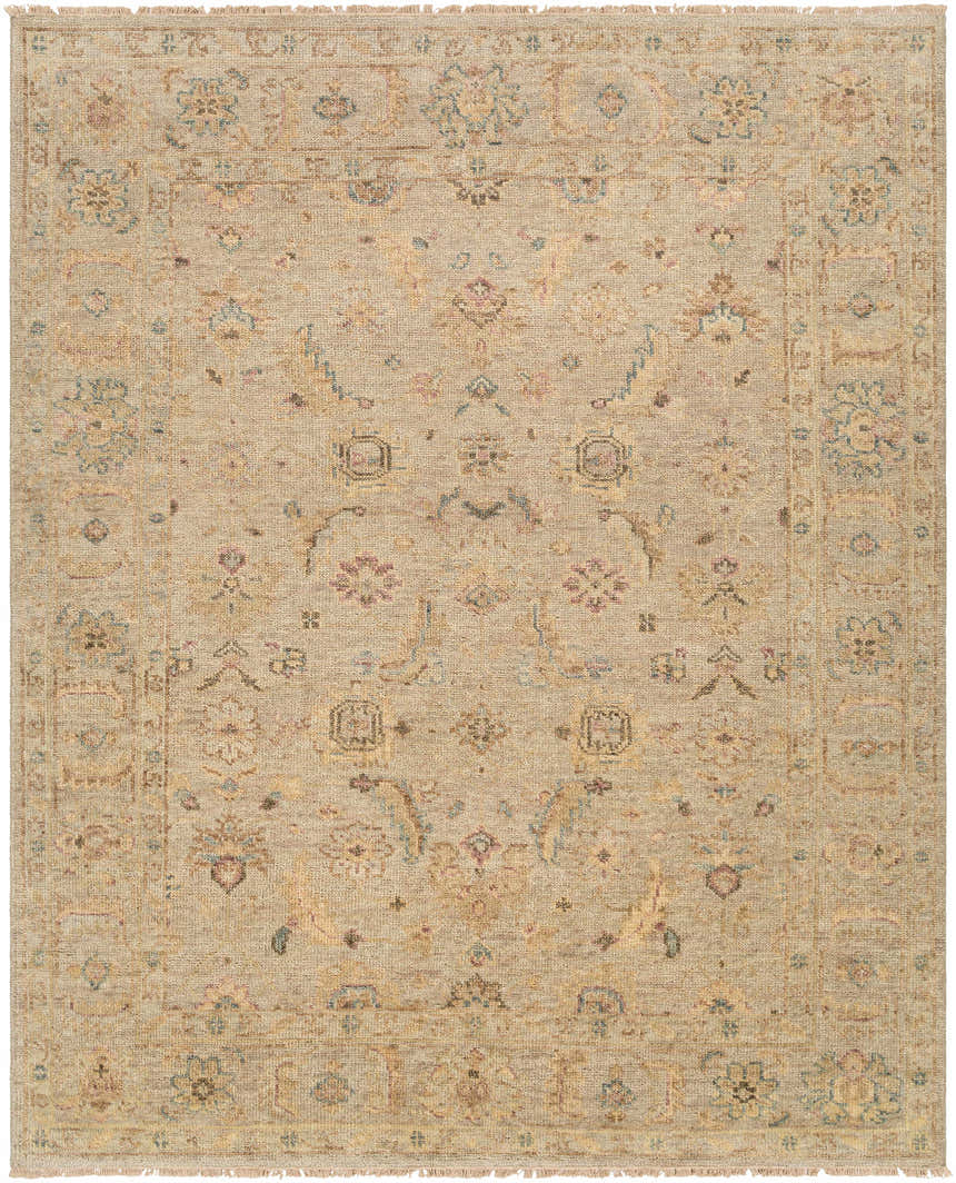 Close-up of the hand-knotted Fabre Area Rug. Beige, ivory, mauve, and gray floral pattern on wool with fringe. Design-Rectangle-810