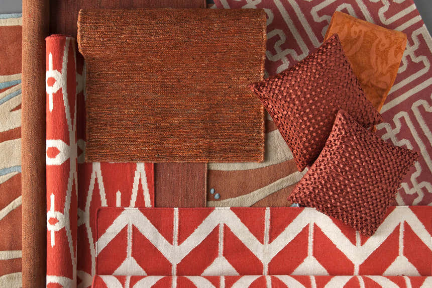 Close-up of Kellogg Area Rug in coral and peach, with hand-woven texture and geometric patterns. Clearance item. Styleshot
