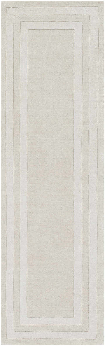 Close-up of the hand-tufted Ferrum Area Rug. Beige and taupe wool rug with a solid striped pattern and soft texture. Design-Runner-268