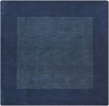 Close-up of the Bordered Solid Ink Blue Wool Rug, showing its subtle texture and two-tone ink blue color. Design-Square-8