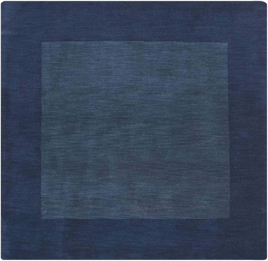Close-up of the Bordered Solid Ink Blue Wool Rug, showing its subtle texture and two-tone ink blue color. Design-Square-8