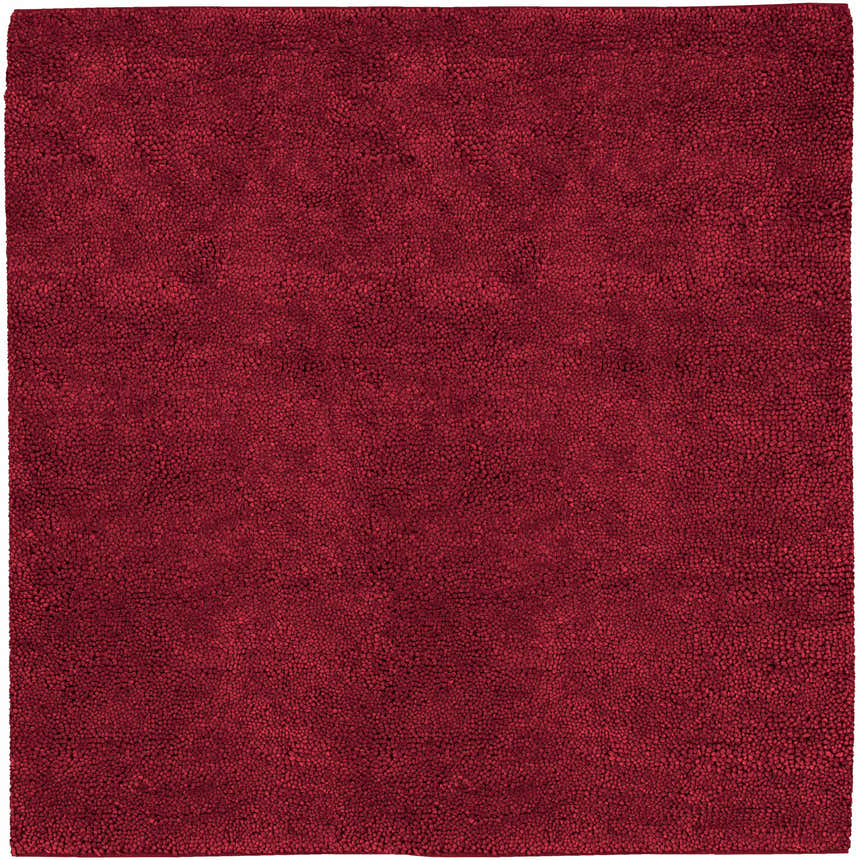 Close-up of the Frederika Solid Dark Red Wool Shag Rug showing its texture and deep red color. Design-Square-8