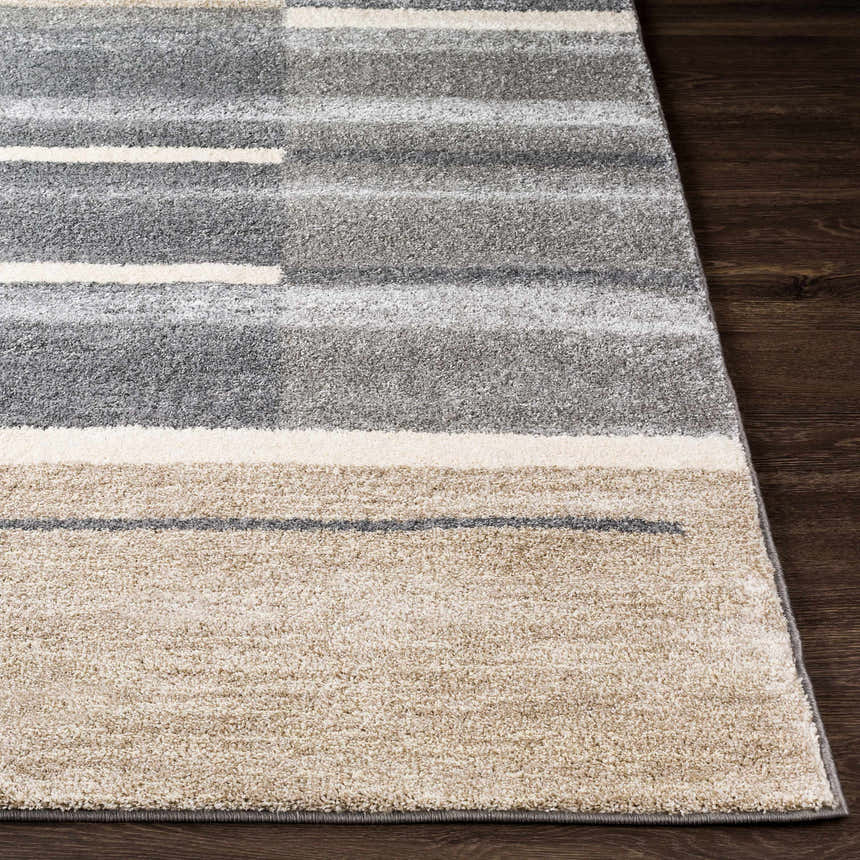 Close-up of Glouster Taupe&Gray Lined Area Rug. Contemporary design with gray, taupe, and off-white stripes. Soft, textured pile. Front