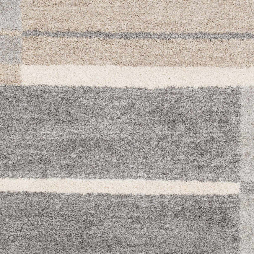 Close-up of the Glouster Taupe&Gray Lined Area Rug, showing its gray, taupe, and off-white colors and soft, textured design. Swatch