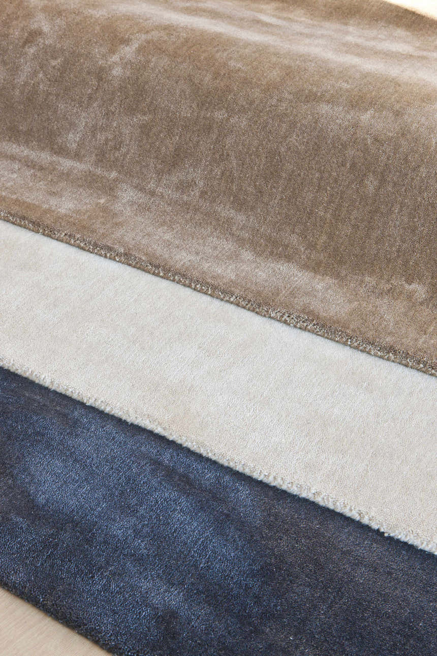 Close-up of Galata Area Rug in brown, cream, and navy. Hand-loomed with a solid design and subtle texture. Styleshot