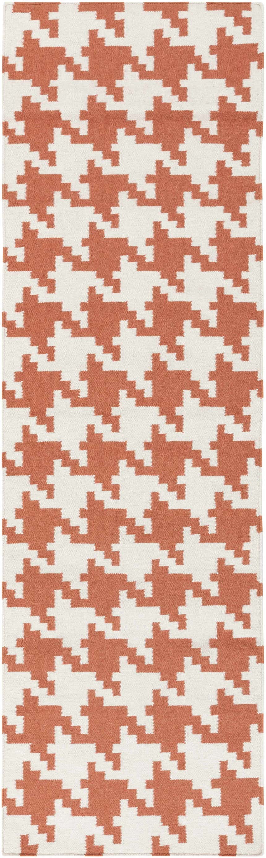 Close-up of the hand woven Goldthwaite Area Rug. Burnt orange and light beige houndstooth pattern. 100% wool texture. Design-Runner-268