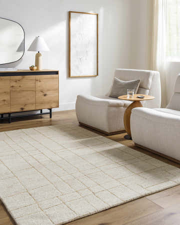 Living room scene with ash and pearl Ailani area rug, wood floors, modern chairs, and a light, airy feel. Roomscene-Rectangle