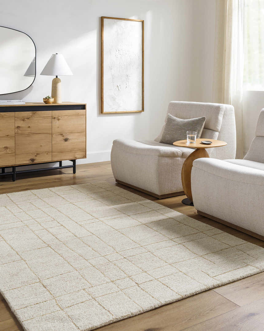 Living room scene with ash and pearl Ailani area rug, wood floors, modern chairs, and a light, airy feel. Roomscene-Rectangle
