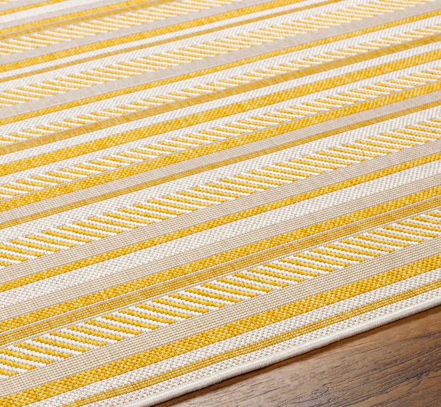 Close-up of Grian Area Rug showing a striped pattern in beige, bone, and gold on a hardwood floor. Texture