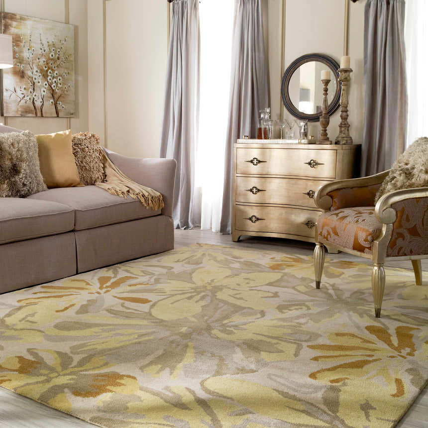 Living room scene with Grindstone Area Rug in light gray, olive, tan, and wheat floral pattern. Sofa, chair, and dresser. Roomscene-Rectangle