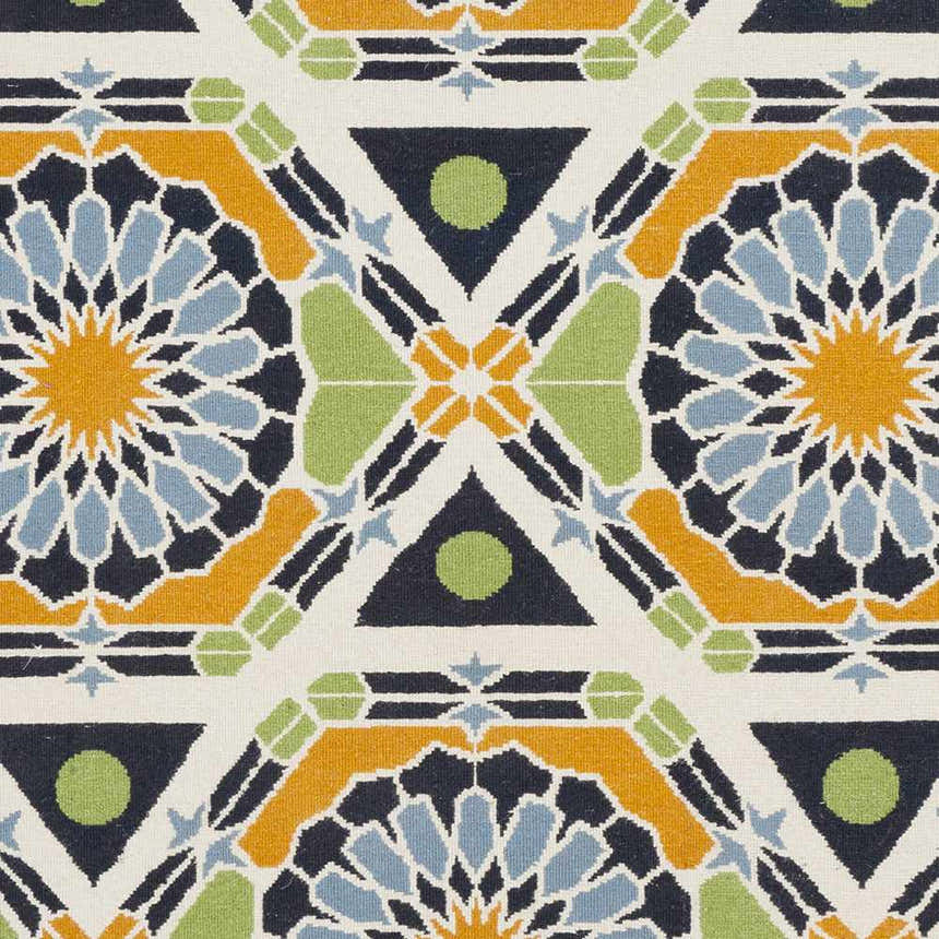 Close-up of Greenough Area Carpet. Hand-knotted wool rug with burnt orange, dark blue, grass green, and ivory geometric design. Swatch
