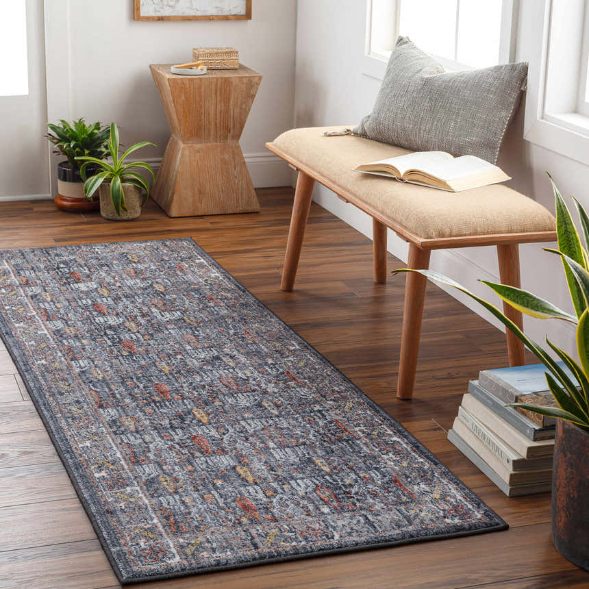 Entryway scene with a farmhouse Guirang Area Rug runner in gray, orange, and yellow tones. Bench, plants, and wood accents. Roomscene-Runner