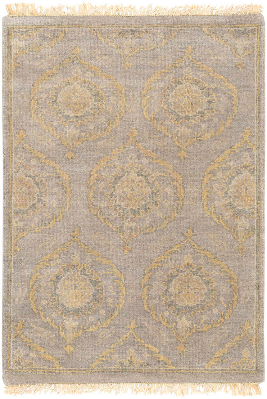 Close-up of the Haleiwa Clearance Rug. Hand-knotted wool rug in camel, taupe, and dark green with a traditional medallion pattern and fringe. Design-Rectangle-23