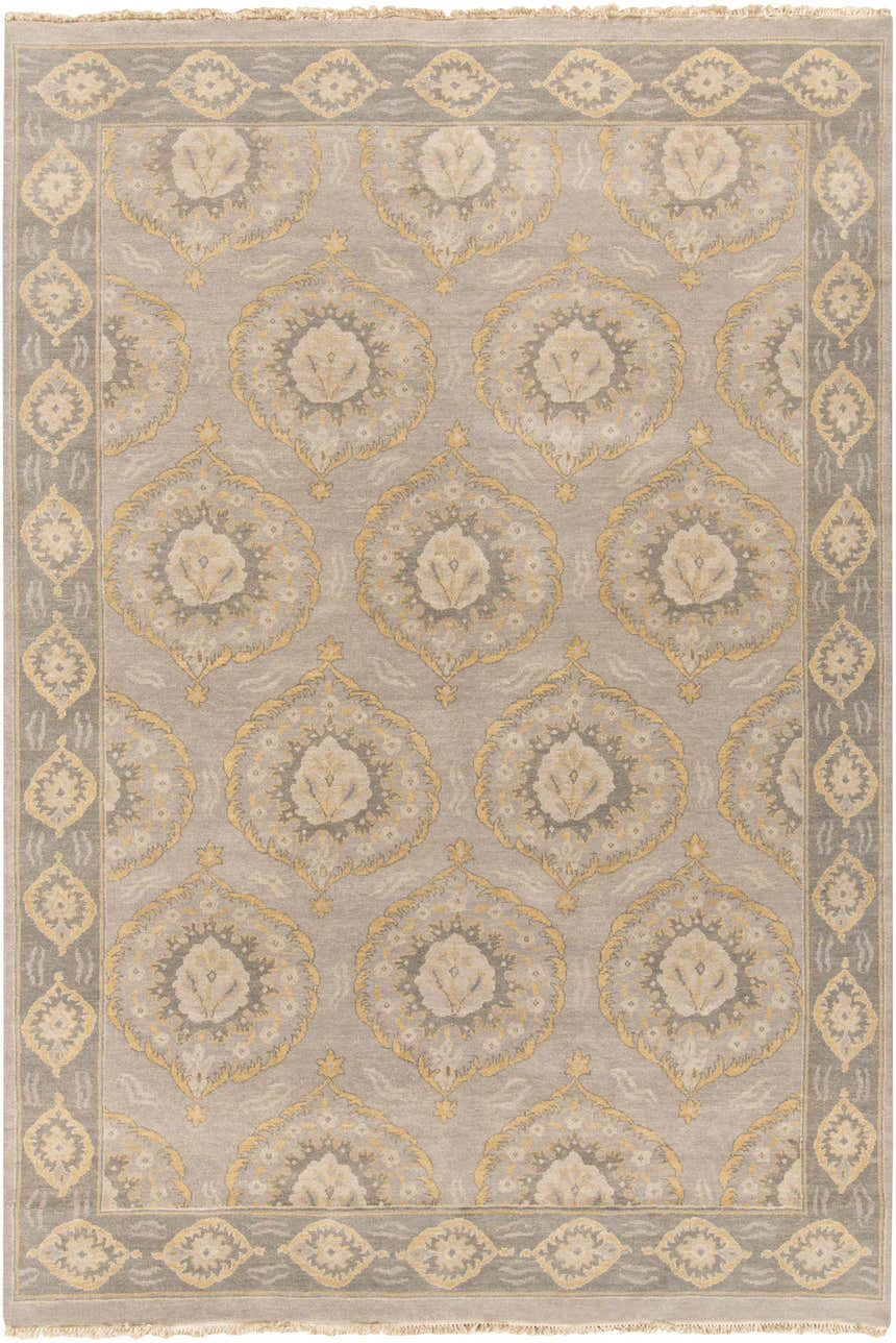 Close-up of the hand-knotted Haleiwa Clearance Rug. Camel, dark green, and taupe wool rug with a traditional floral medallion pattern. Design-Rectangle-69