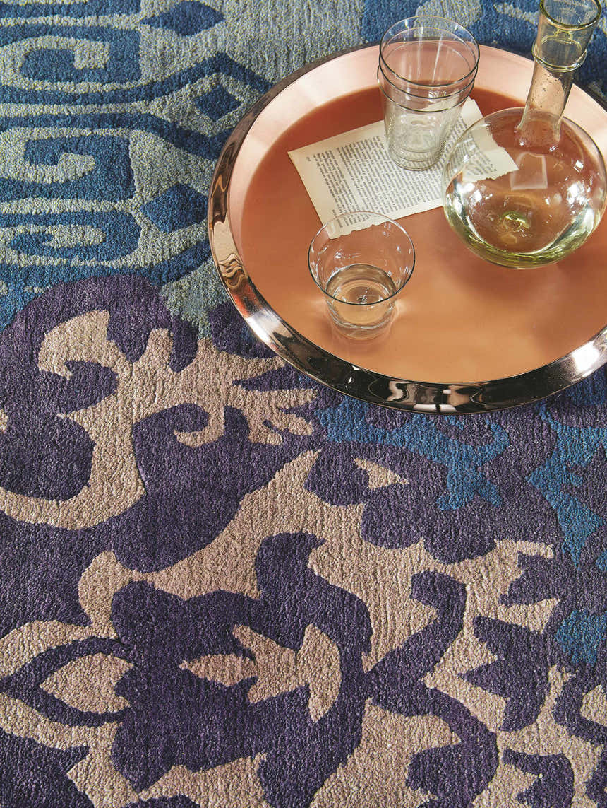 Close-up of the Hallsboro Area Rug. Contemporary design in charcoal, light brown, medium gray, and silverstone. 100% NZ Wool. Styleshot