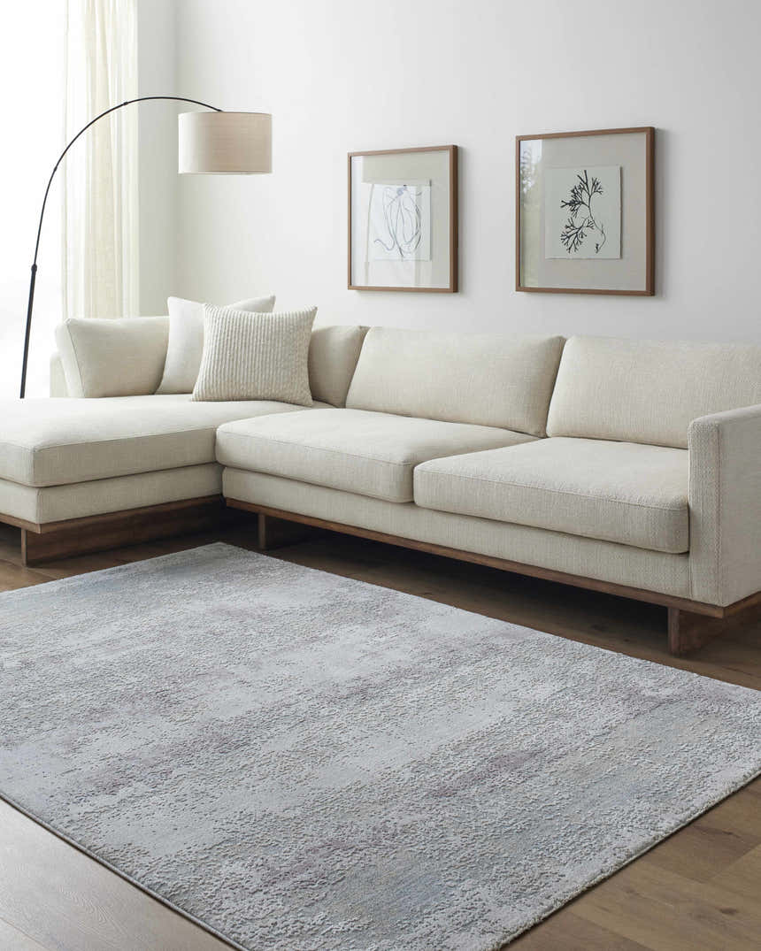 Living room scene with a neutral sectional sofa and gray Hanne Thick Luxe Rug. Roomscene-Rectangle