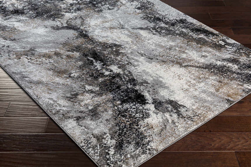 Close-up of the Contemporary Marble Area Rug, featuring a black, gray, and ivory marble-like pattern. Corner