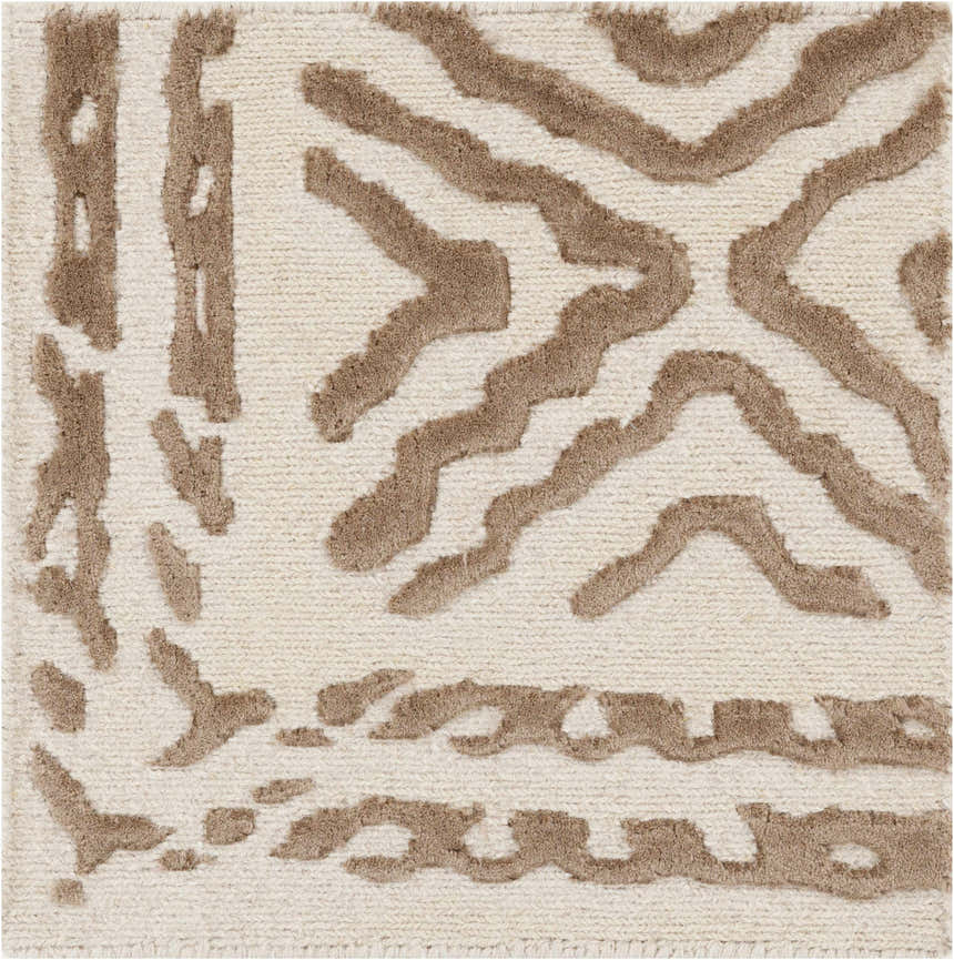 Close-up of the Halesworth Premium Area Carpet. Brown, geometric pattern on light beige wool. Hand-knotted texture. Texture