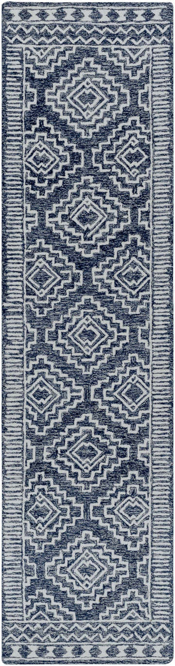 Close-up of the Horton Modern Wool Rug; navy and beige geometric pattern, hand-tufted texture. Bohemian style. Design-Runner-2610