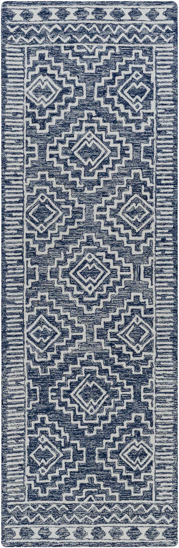 Close-up of the Horton Modern Wool Rug. Hand-tufted runner rug in navy and beige with a geometric, bohemian-inspired pattern. Design-Runner-268